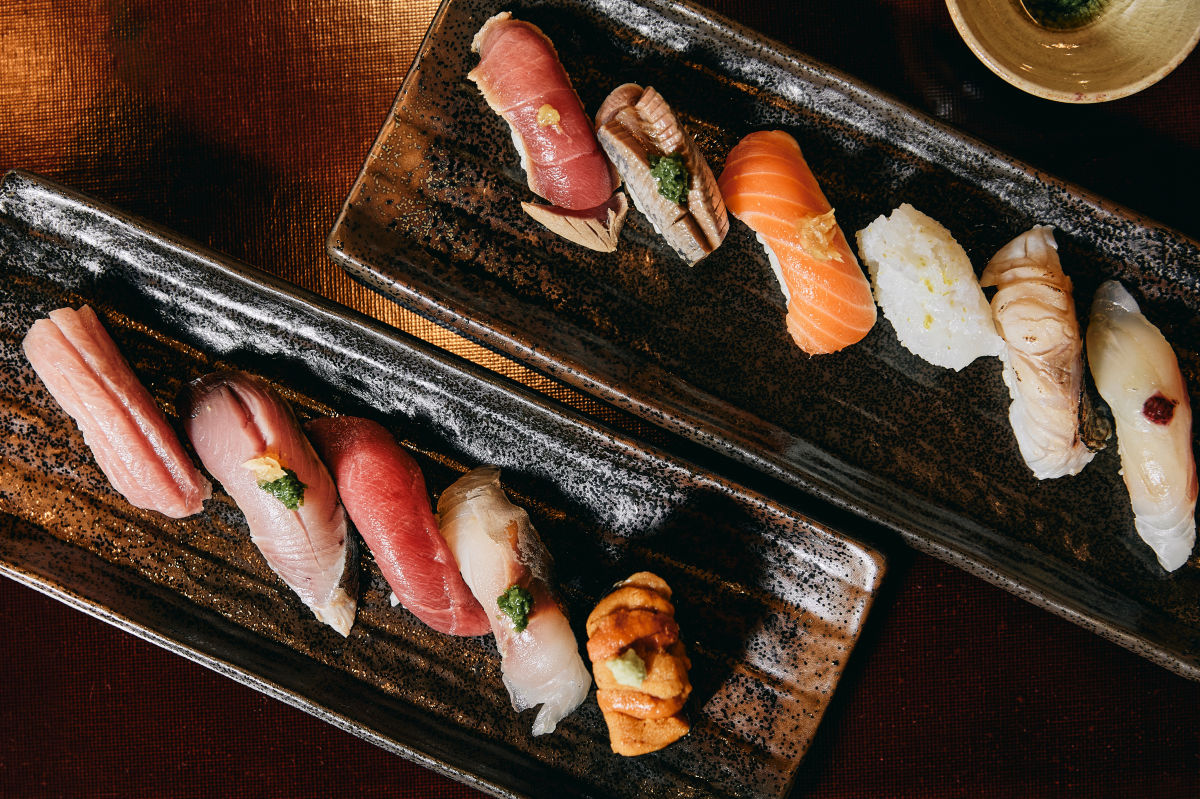 A full omakase course laid out on the counter